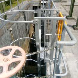 Access ladder for water treatment facilities Cage ladder used to go down a well in a water treatment facility.